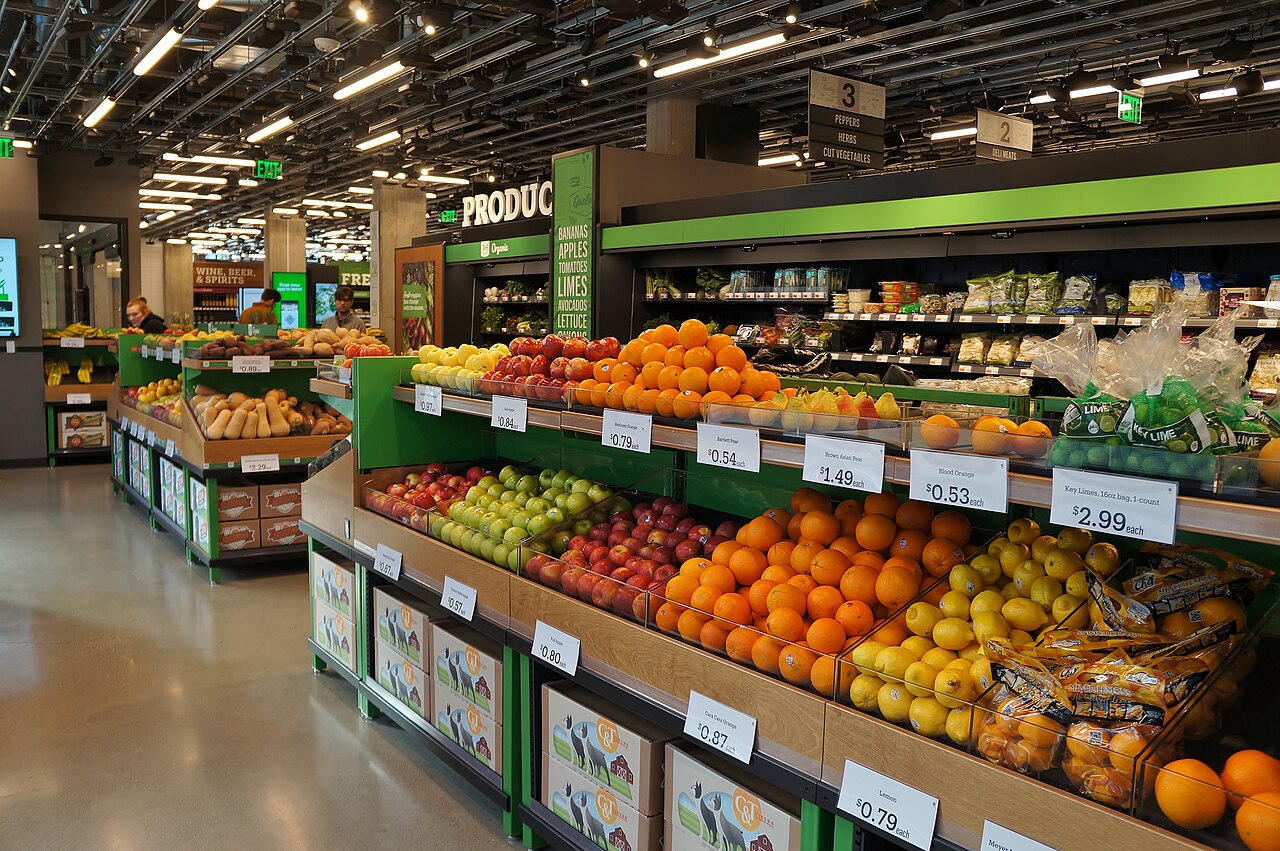 Fresh produce displayed in a grocery store aisle